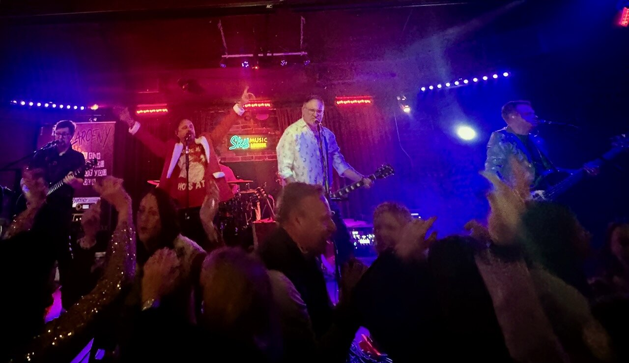 Larceny rocking a packed house with crowd dancing at Sky Music Lounge