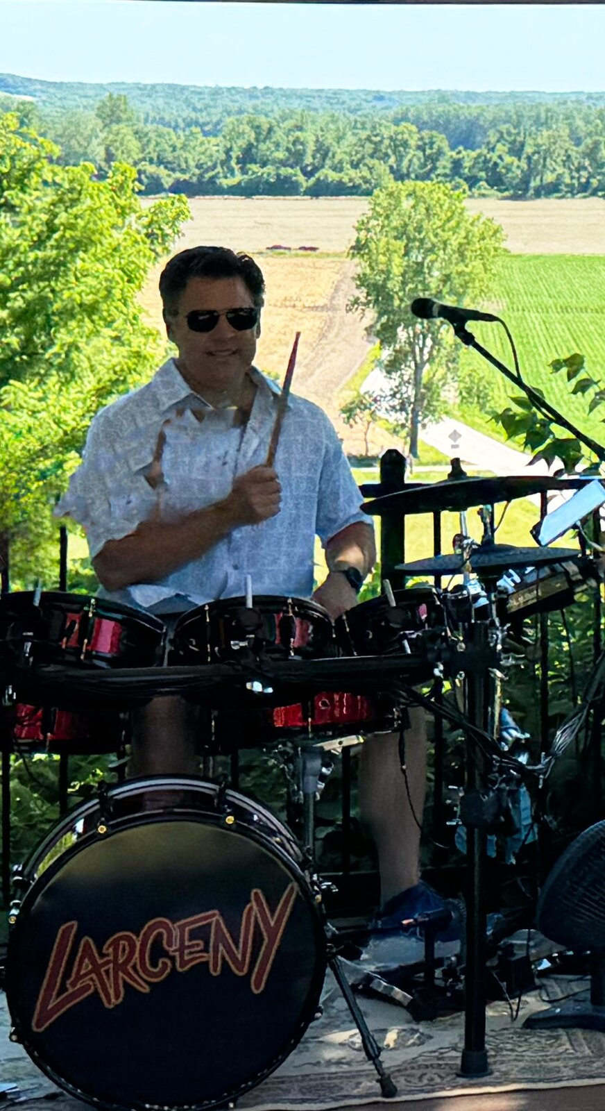 John playing drums outdoors at winery