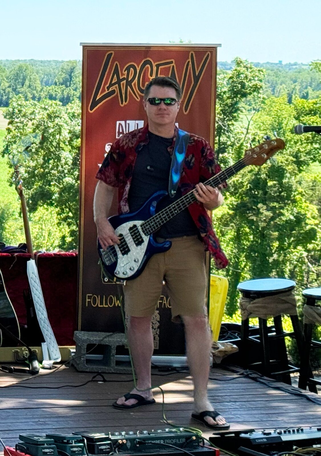 Tim Rooney performing bass at outdoor show
